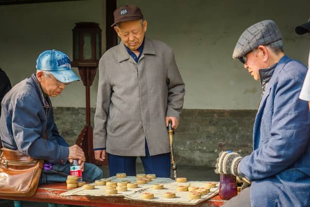 old asians playing chess